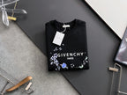 Black crewneck sweatshirt with floral wreath logo and hanging white tag