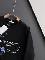 Black crewneck sweatshirt with blue floral graphic and “GIVENCHY” text on chest