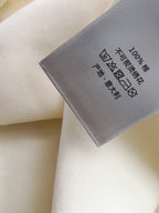 Inside neck label showing care symbols on the two-tone hoodie