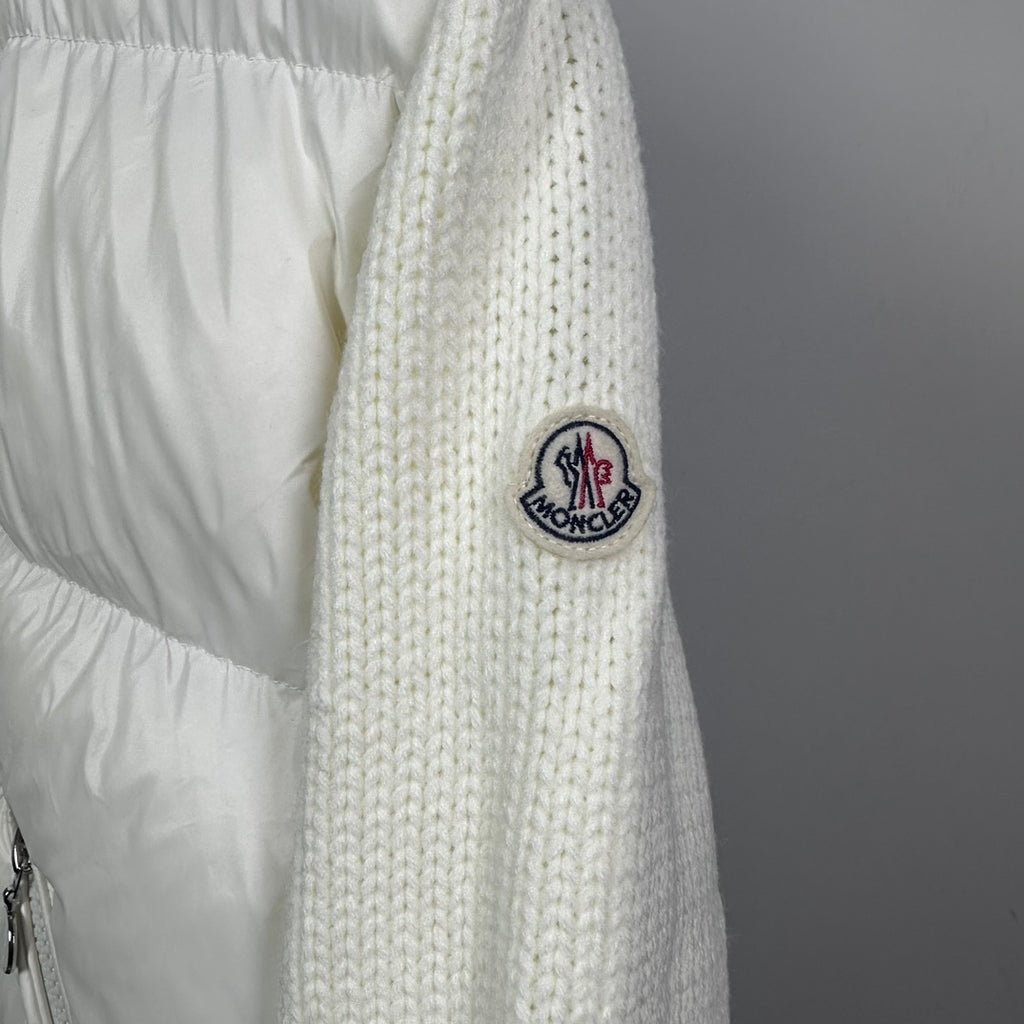 Long puffer jacket sleeve with off-white knit cuff and MONCLER crest patch