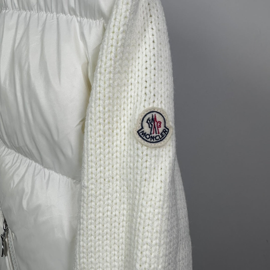Long puffer jacket sleeve with off-white knit cuff and MONCLER crest patch