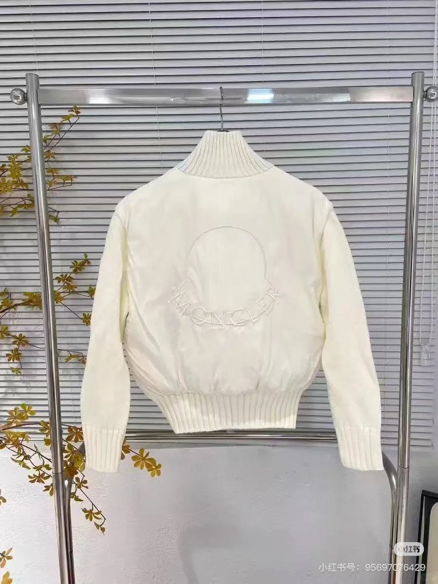 Moncler padded jacket with ribbed turtleneck, front zipper, and knit cuffs, white