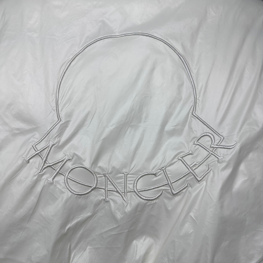 Long puffer jacket back with off-white embossed MONCLER lettering