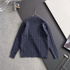 Dark blue textured knit sweater back view on hanger