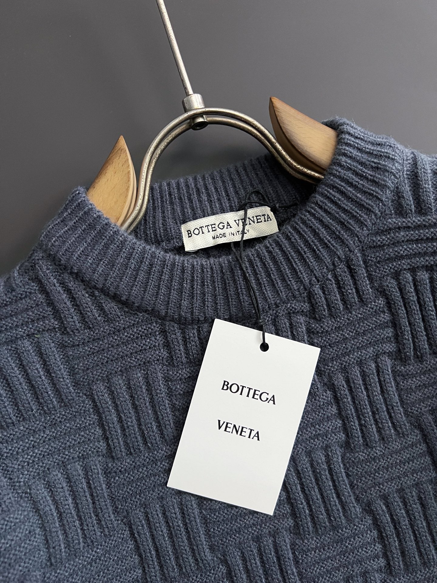 Dark blue ribbed knit sweater neckline with Bottega Veneta brand tag
