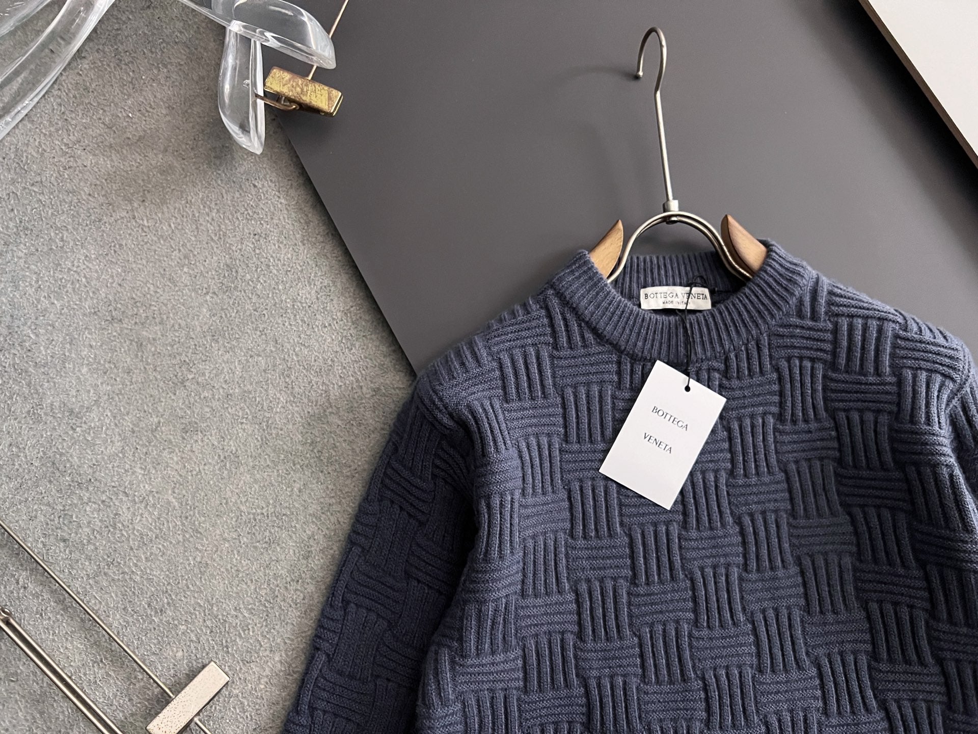 Dark blue crew-neck knit sweater with raised woven pattern
