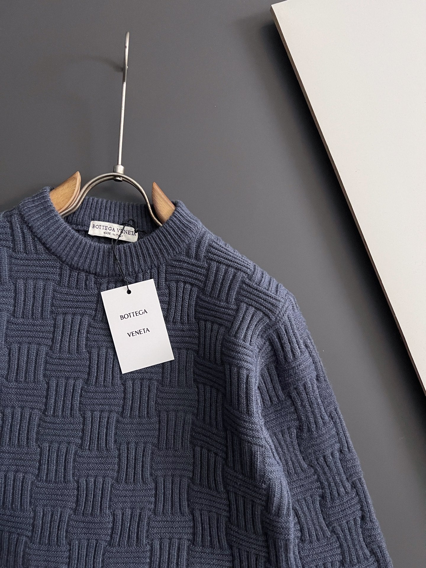 Dark blue crew-neck knit sweater with allover raised geometric texture