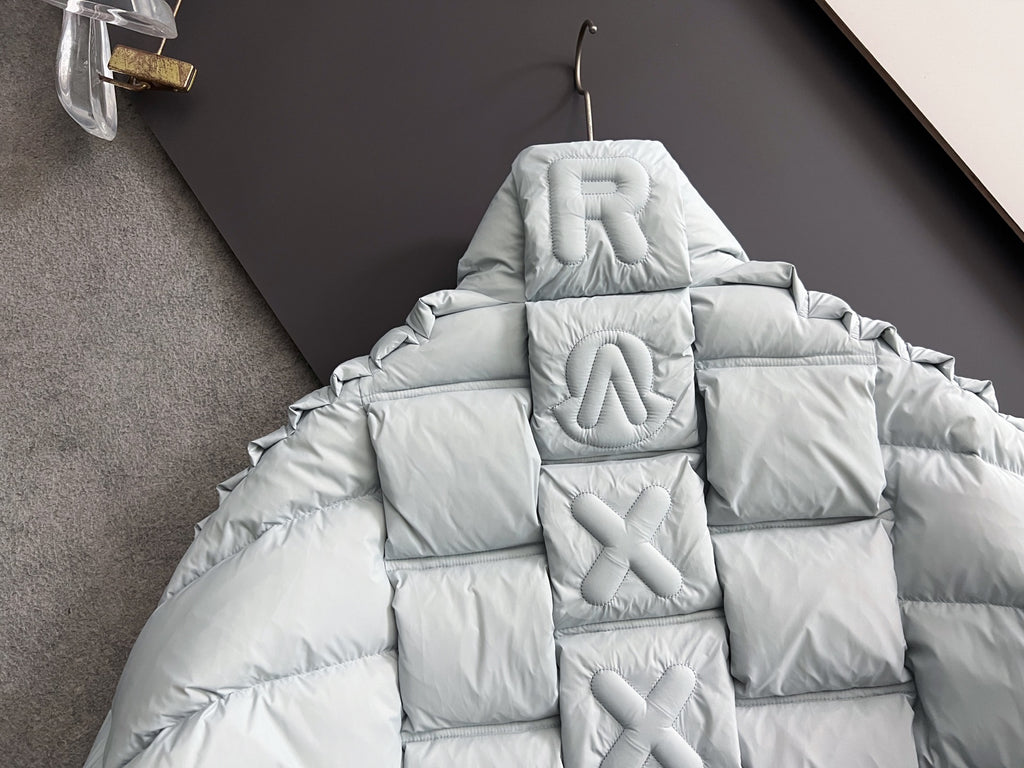 Moncler light puffer jacket hood with embossed monogram details on back
