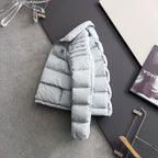 Moncler light puffer jacket with hood, side view, small chest logo patch