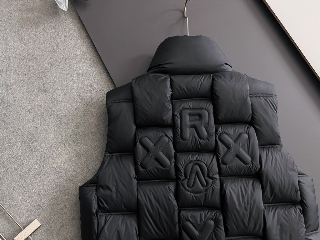 Black long puffer jacket back view with quilted 3D letters and hood