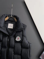Black long puffer jacket hood with zipper and circular crest emblem patch