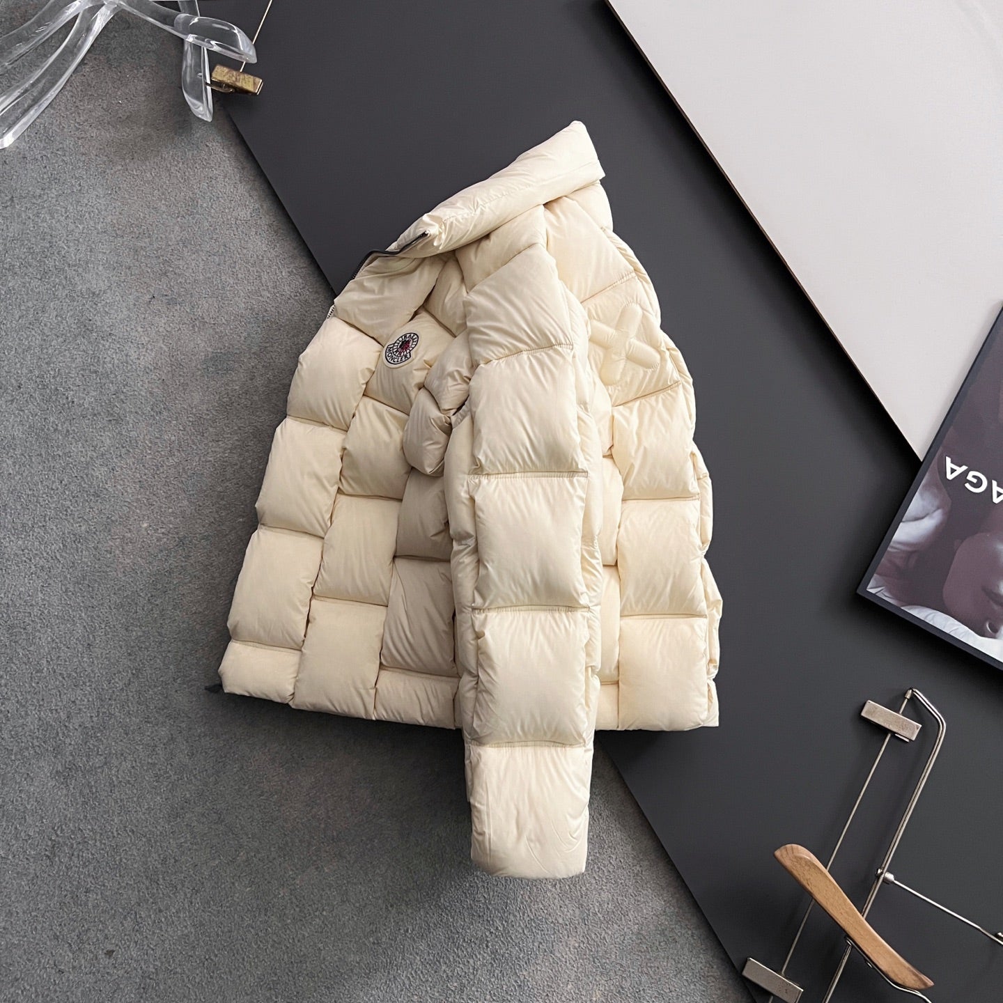 Moncler long puffer jacket, cream, side view with chest logo patch