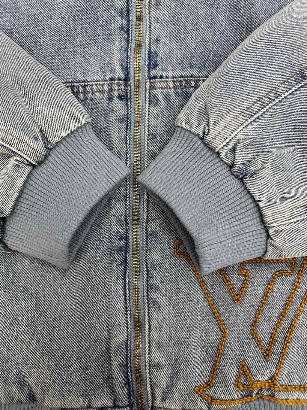 Light blue denim zip-up hoodie with ribbed cuffs and gold-trimmed LV logo