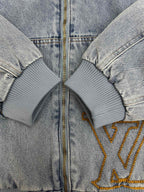 Light blue denim zip-up hoodie with ribbed cuffs and gold-trimmed LV logo