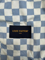 Louis Vuitton black fabric label with gold text on denim jacket