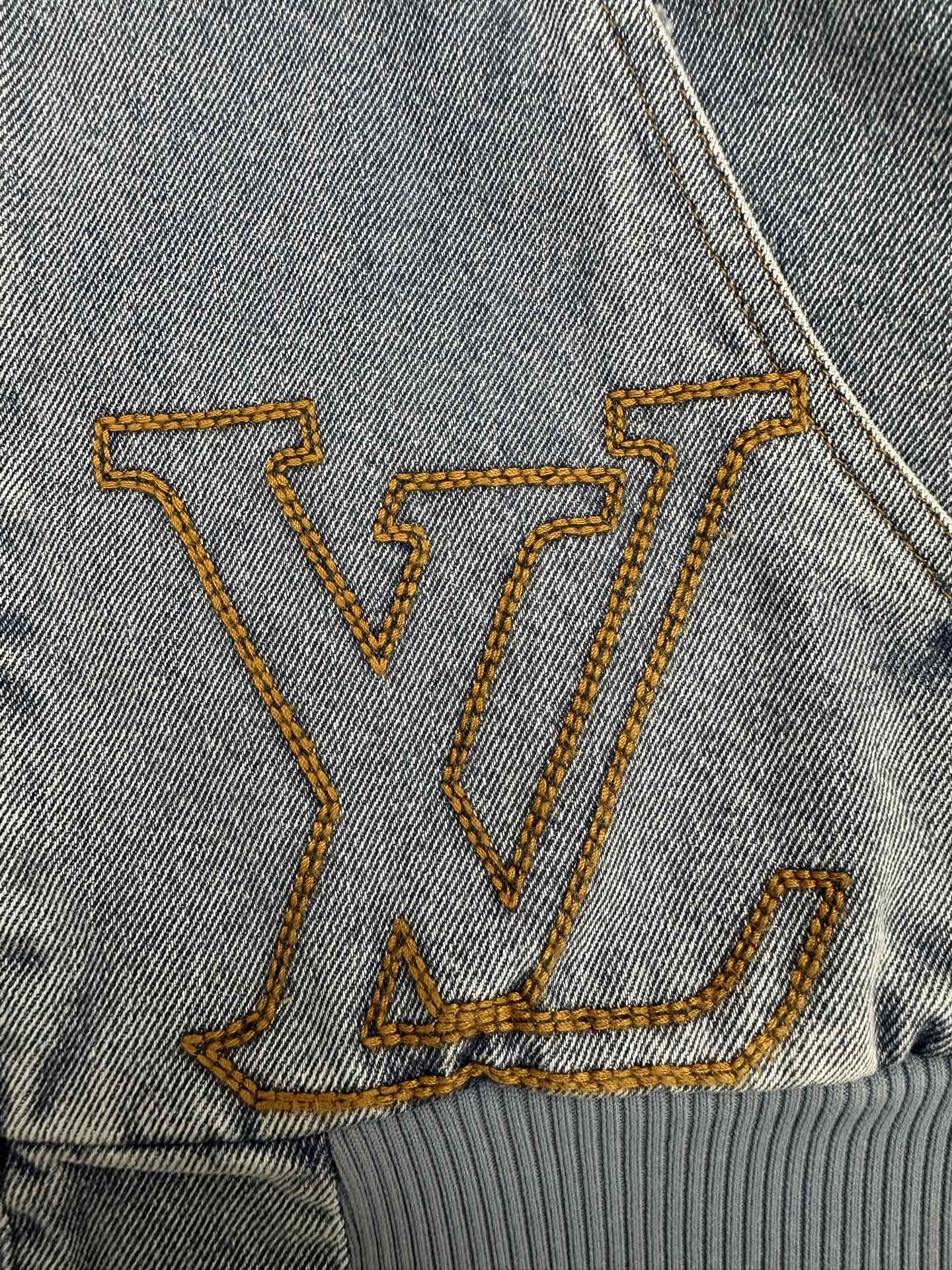Denim long garment with embroidered LV-style monogram in gold thread