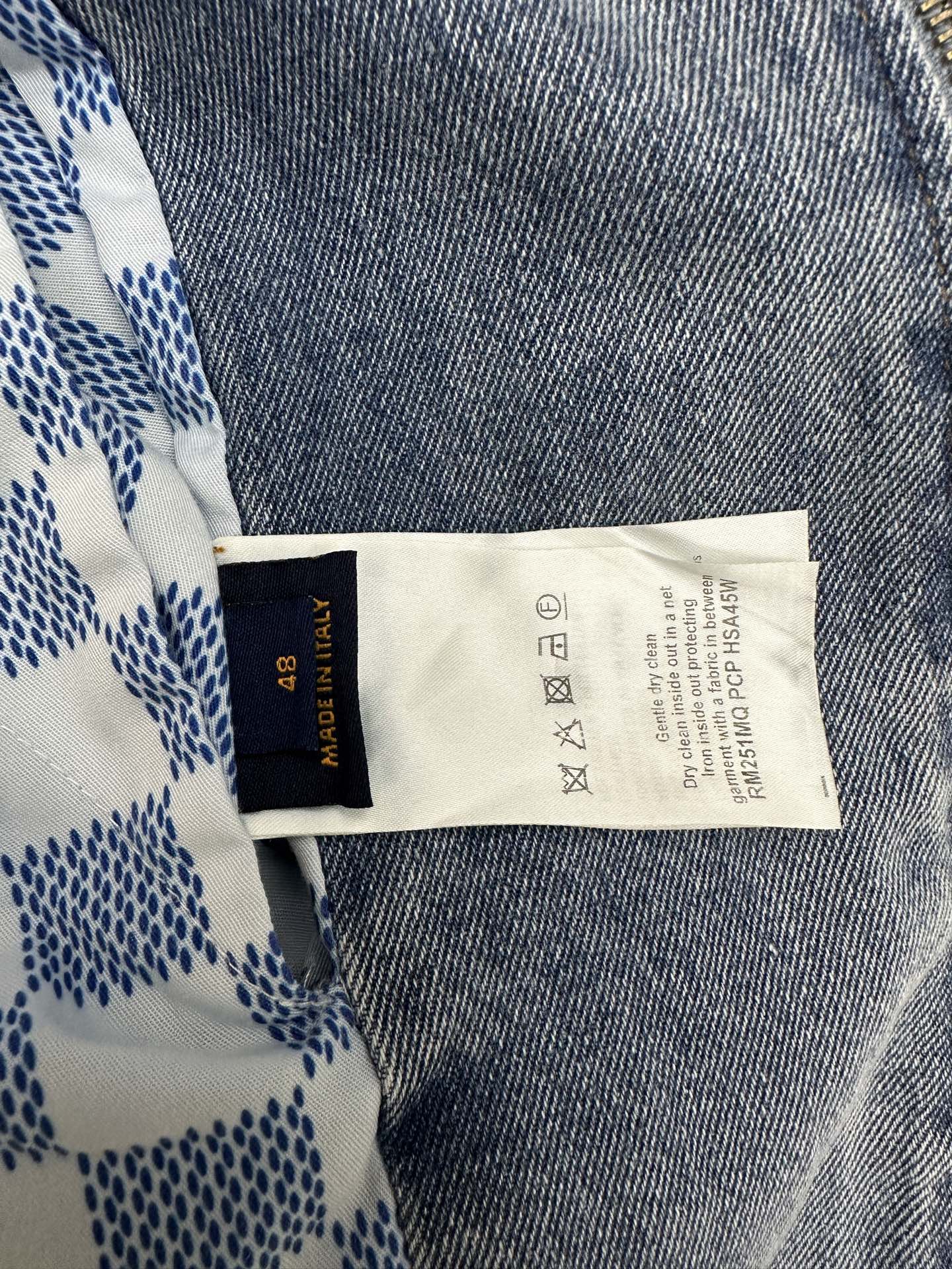 Denim jacket care label tag on inner collar