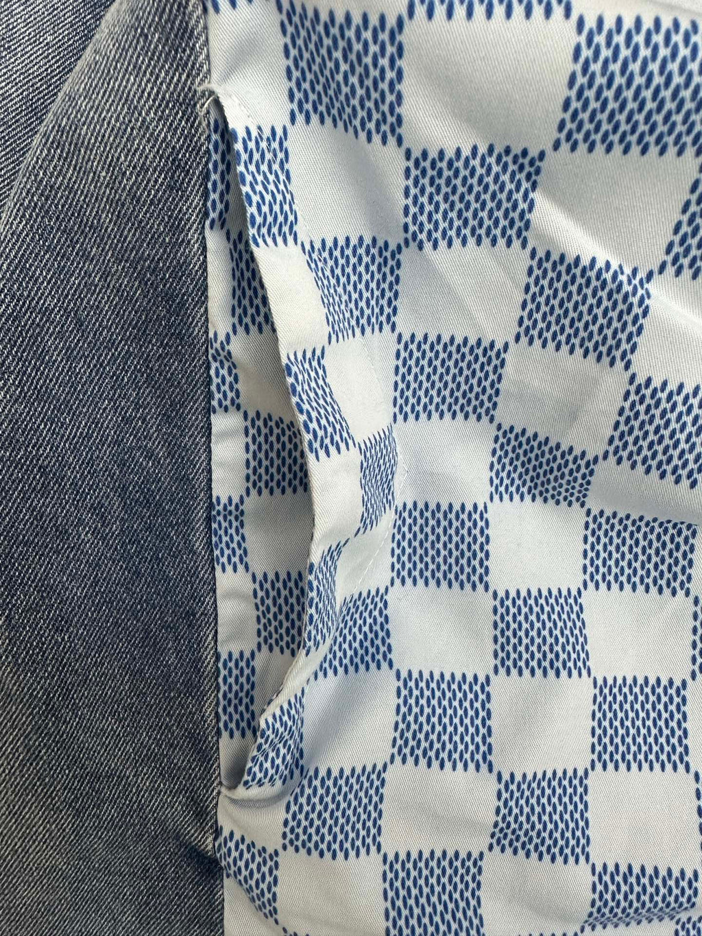 Blue and white checker-pattern fabric panel on long garment
