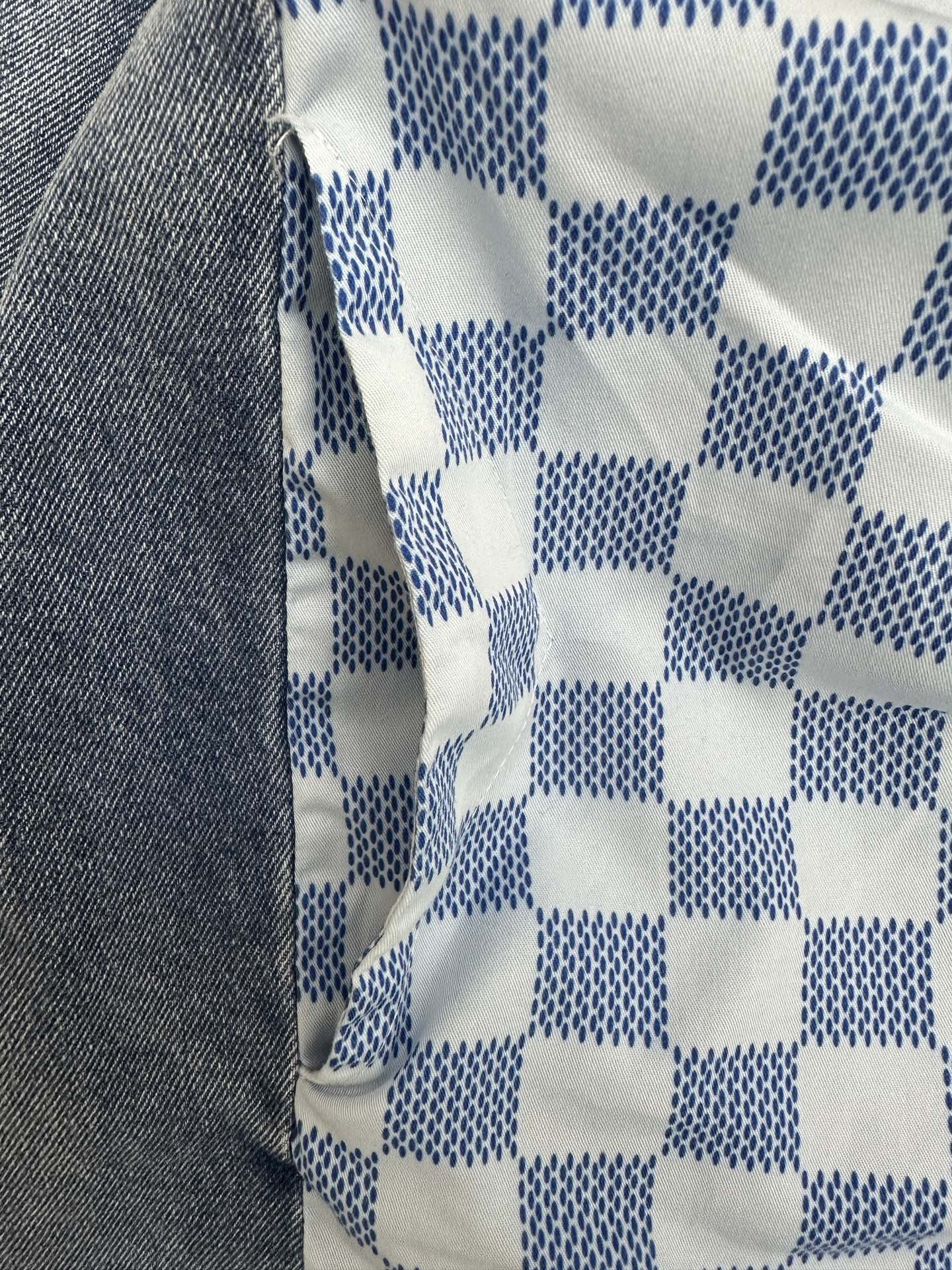 Blue and white checker-pattern fabric panel on long garment