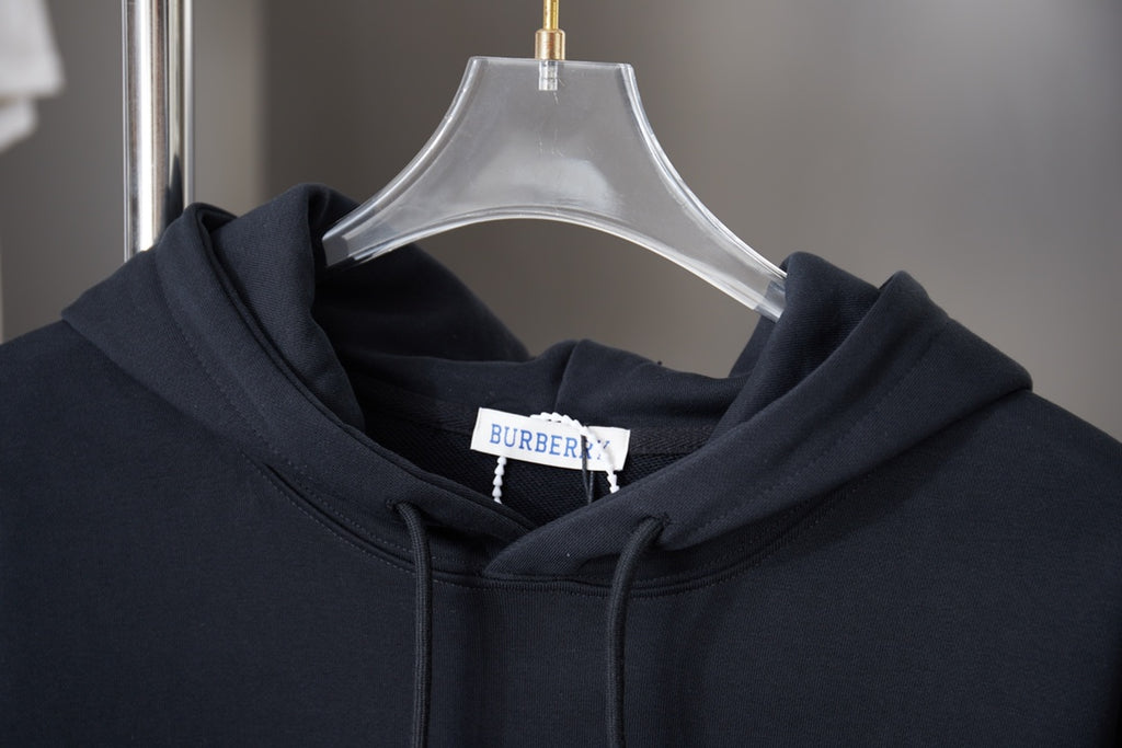 Burberry navy hoodie hood with drawstrings and neck label, close-up
