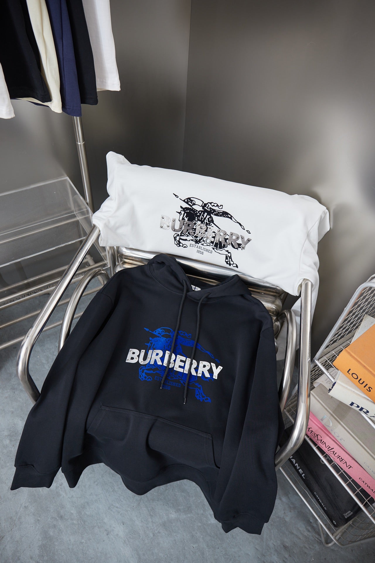 Burberry navy hoodie with blue logo graphic, shown with a white T-shirt