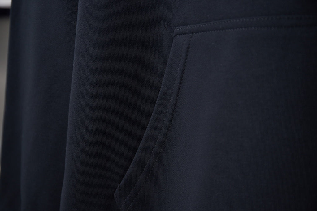 Burberry navy hoodie fabric and stitched kangaroo pocket seam detail