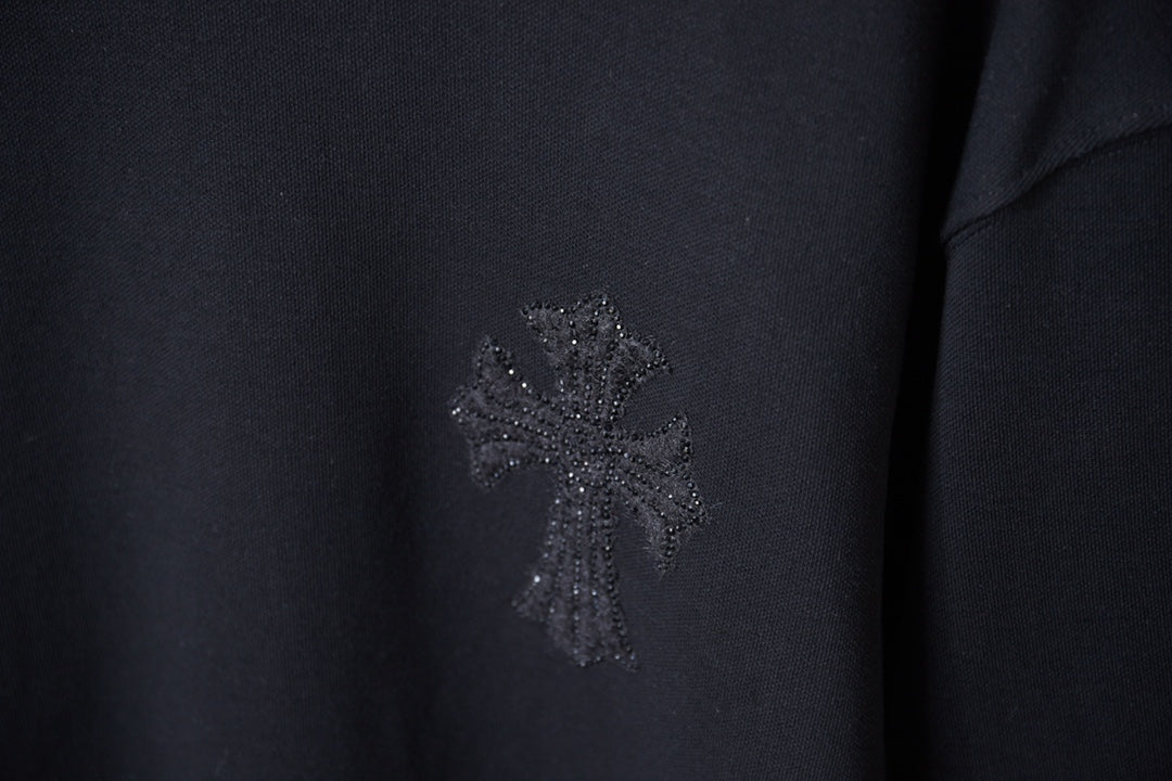 Black sweatshirt chest with sparkling rhinestone logo