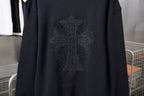 Black sweatshirt back with large rhinestone cross-like emblem