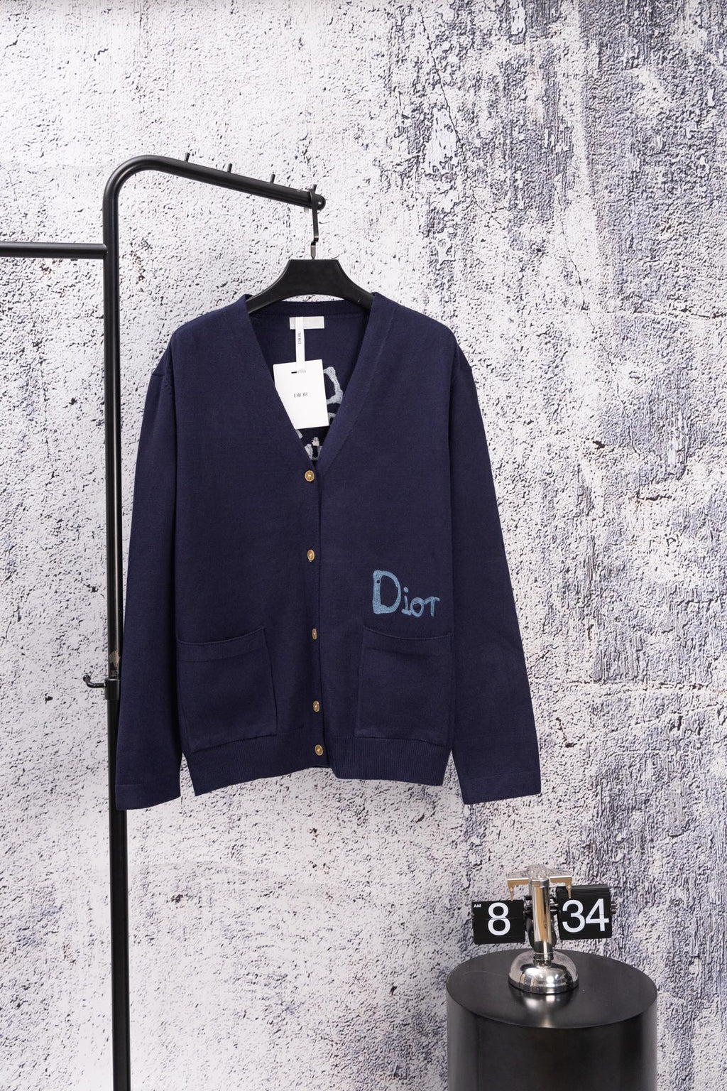 Navy long-sleeve cardigan with front buttons and blue Dior logo detail