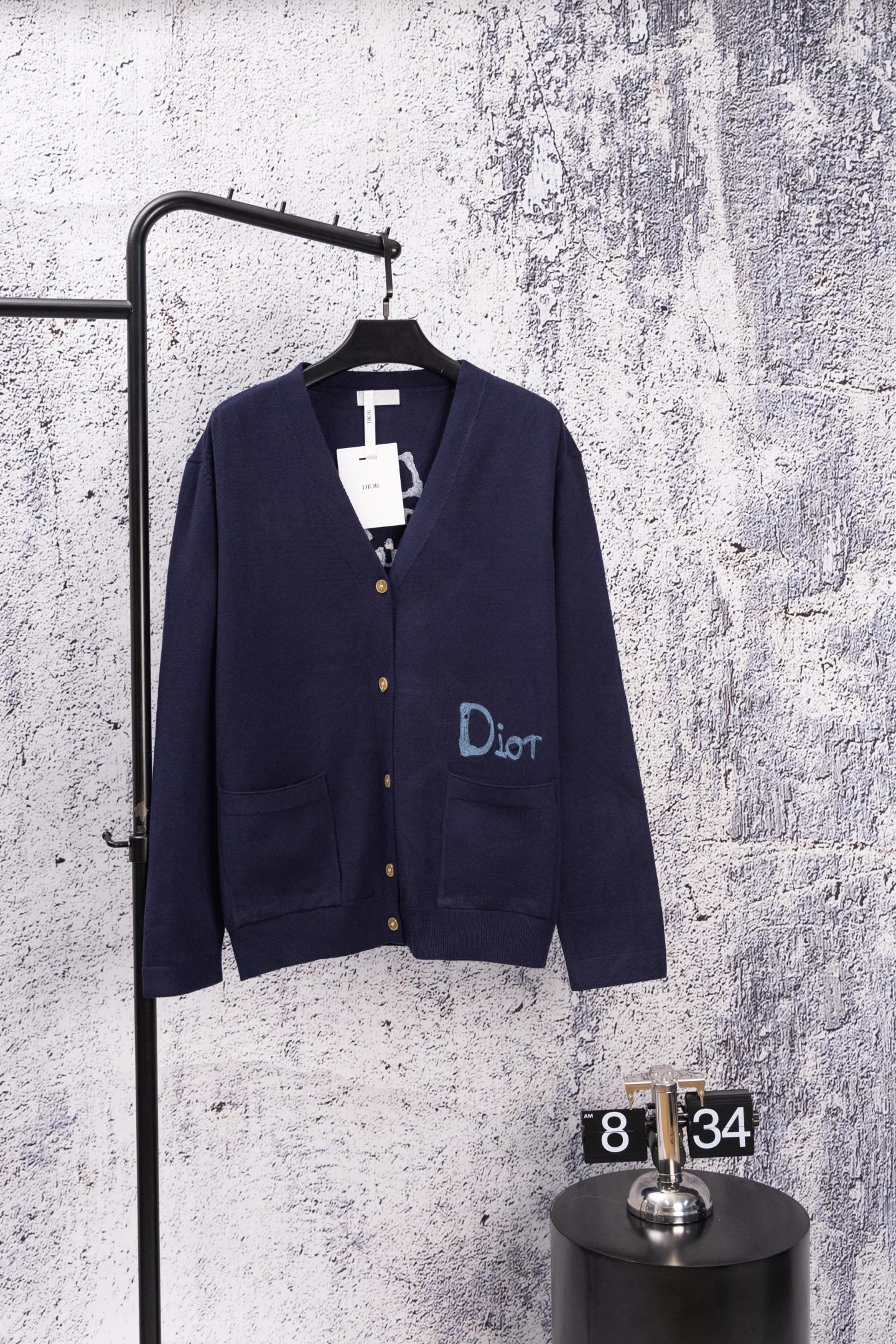 Navy long-sleeve cardigan with front buttons and blue Dior logo detail