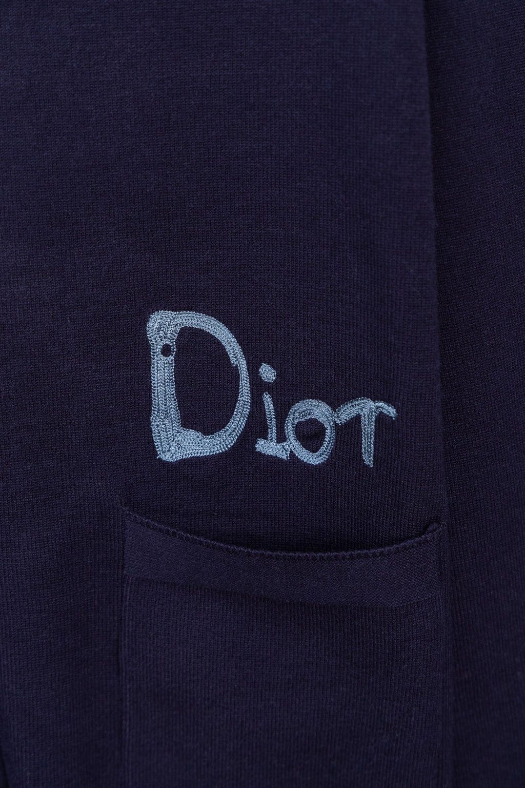 Navy cardigan with blue Dior logo embroidery and front pocket detail