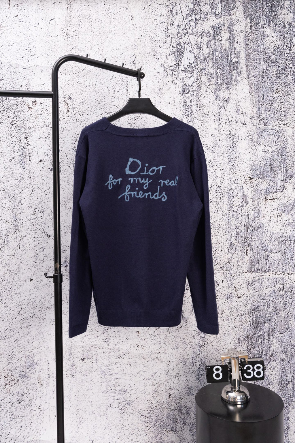 Navy long-sleeve cardigan with back text graphic and blue logo stitching