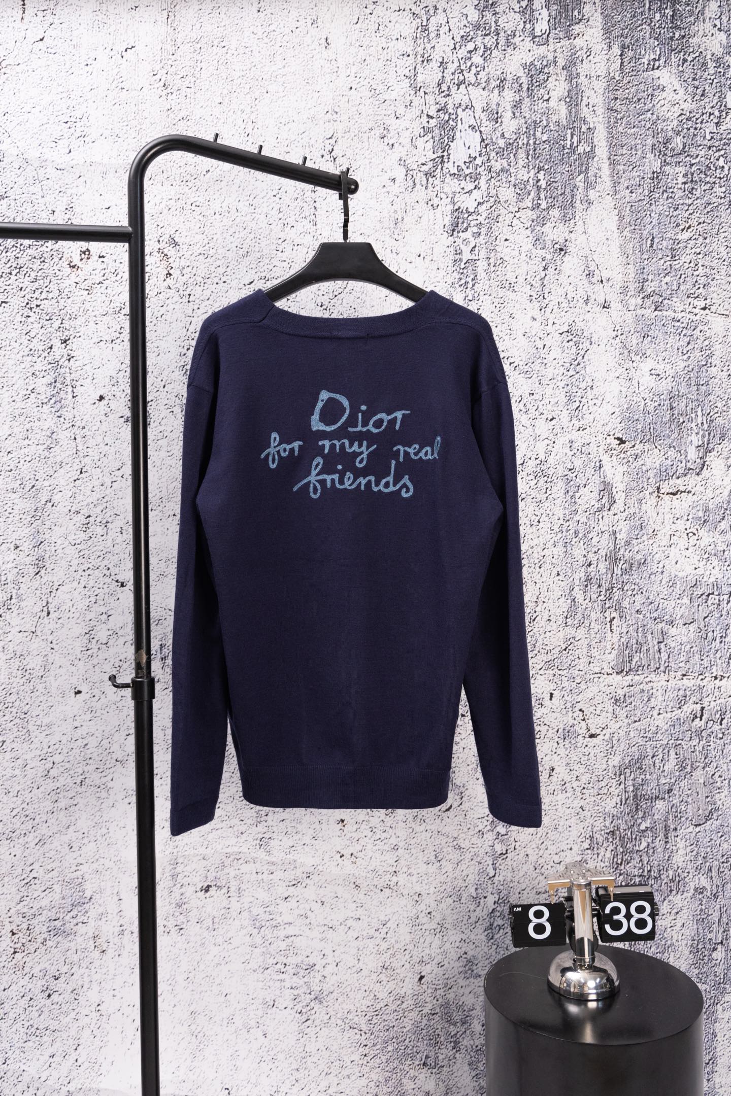 Navy long-sleeve cardigan with back text graphic and blue logo stitching