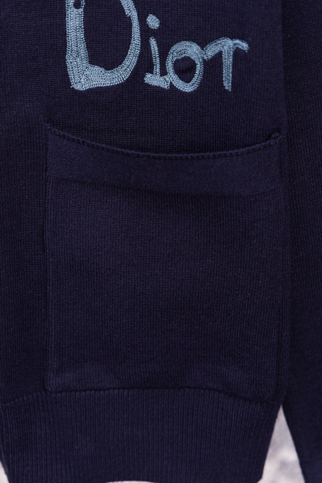 Navy cardigan front pocket with embroidered blue logo