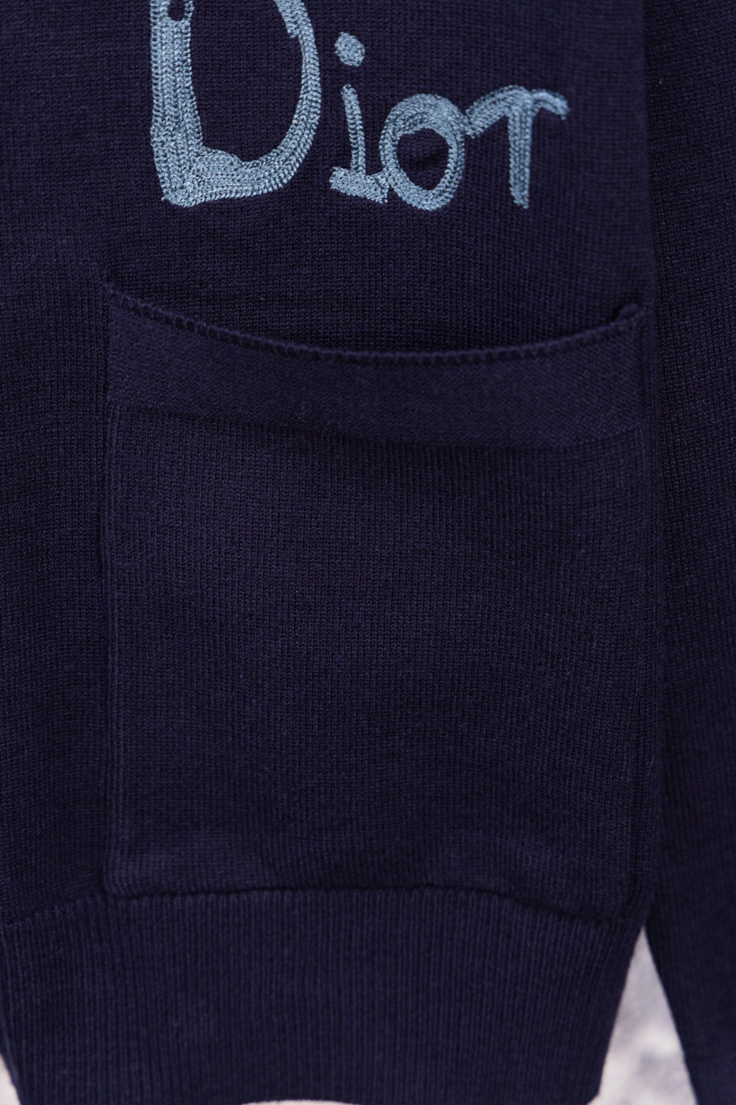 Navy cardigan front pocket with embroidered blue logo