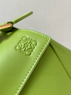 Loewe lime green leather bag detail with embossed logo on side panel