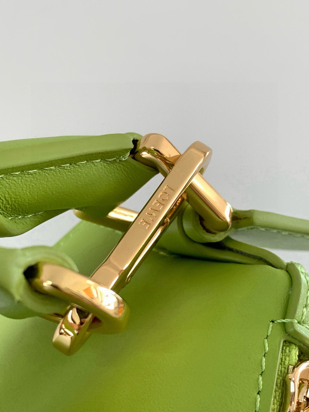 Loewe men’s lime-green leather bag with gold-tone swivel clasp and strap loop