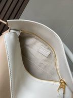 Loewe bag interior pocket with gold zipper and “LOEWE” logo label