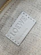 Loewe bag interior label close-up with “LOEWE” text on light fabric