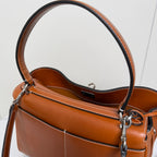 Balenciaga leather bag interior view with top opening, stitched trim, and metal strap hardware