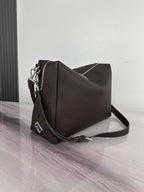 Fendi shoulder bag in dark brown with textured finish, side view, and crossbody strap