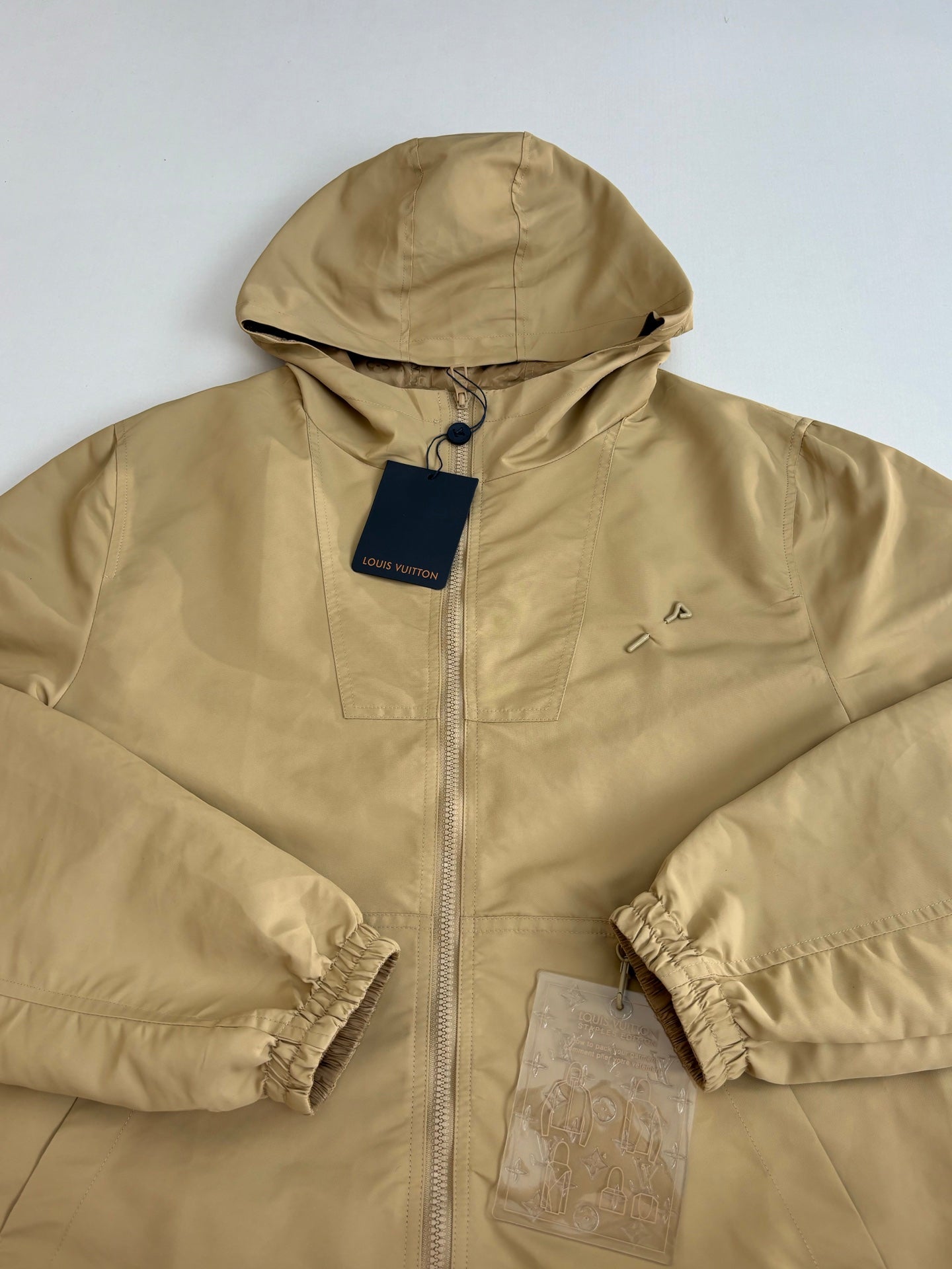 Louis Vuitton hooded jacket close-up, tan monogram, zip front