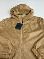 Louis Vuitton hooded jacket close-up, tan monogram pattern, front zip