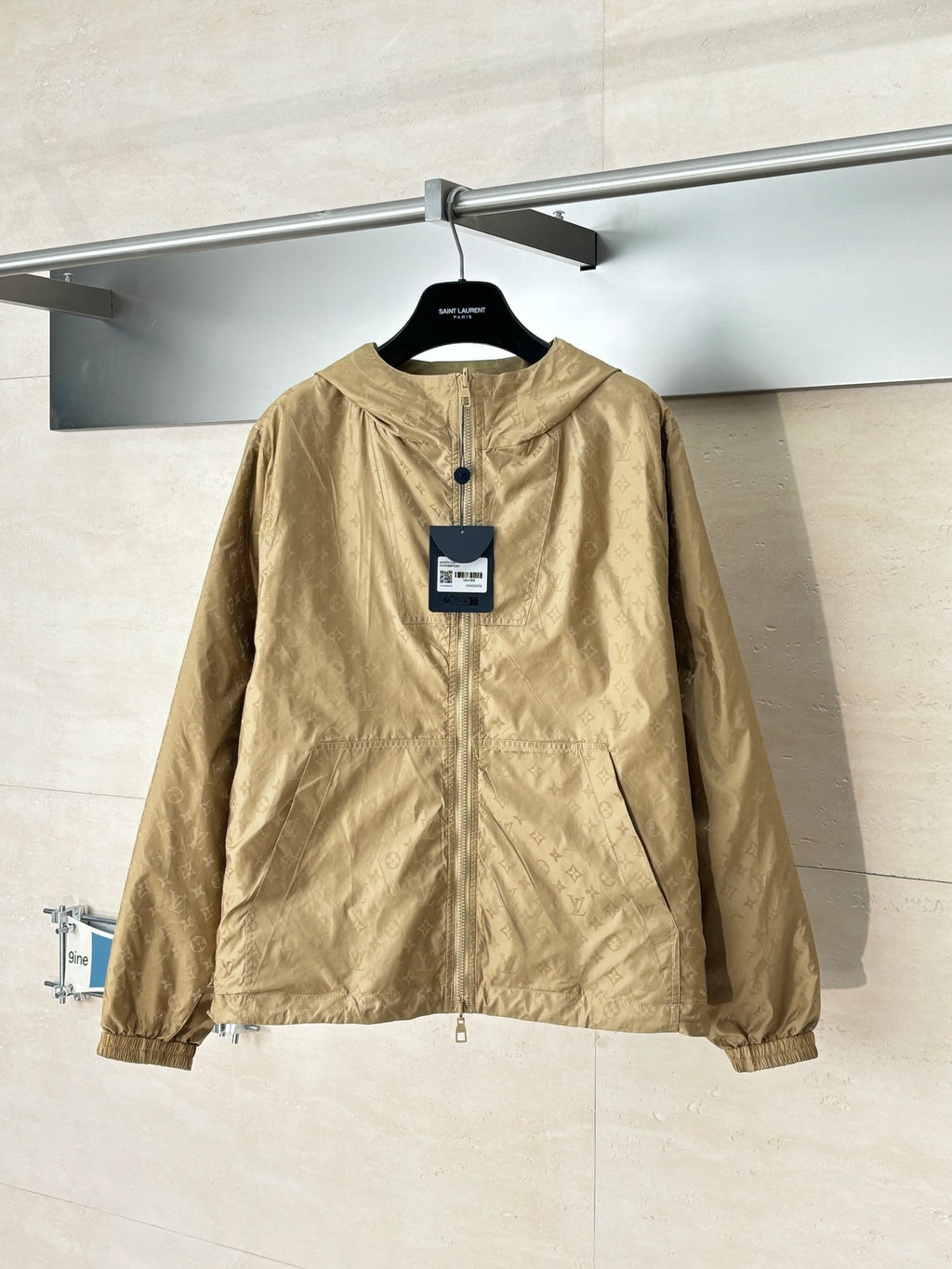 Louis Vuitton tan hooded jacket, front view with zipper and side pockets