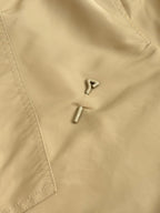 Long pants with metal button and front zipper, beige