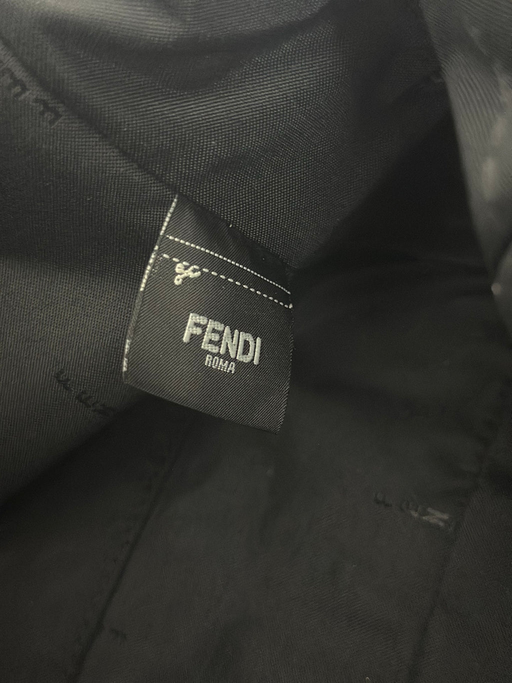 Fendi Roma fabric label on dark interior lining