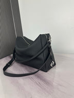 Fendi dark leather crossbody bag with curved front, side strap, and Fendi logo detail