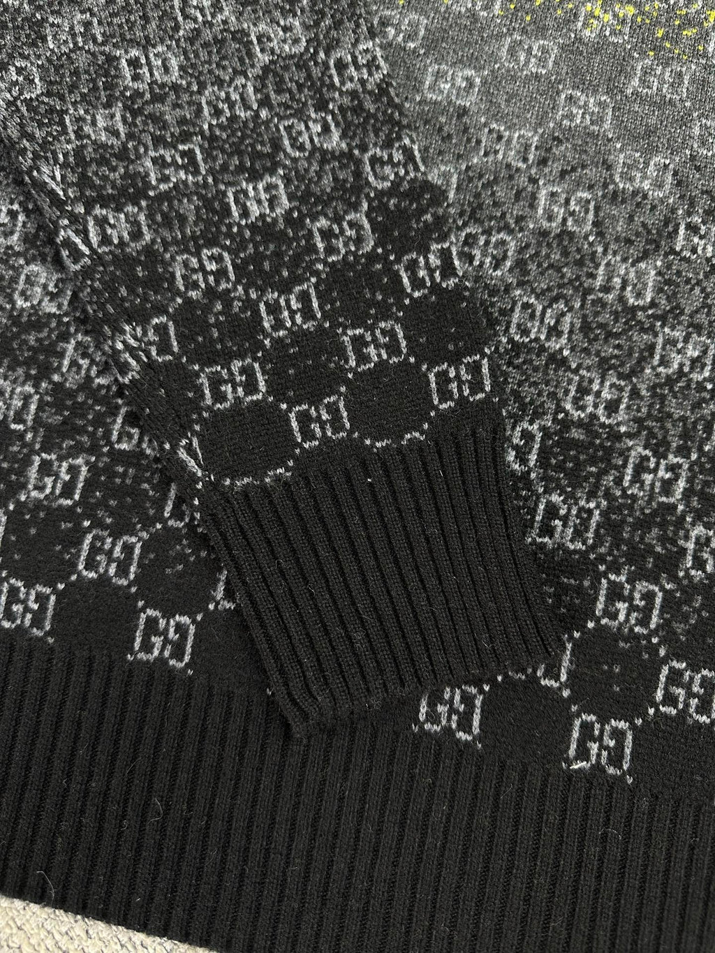 Gucci knit sweater sleeve cuff in dark gray with ribbed hem and GG pattern