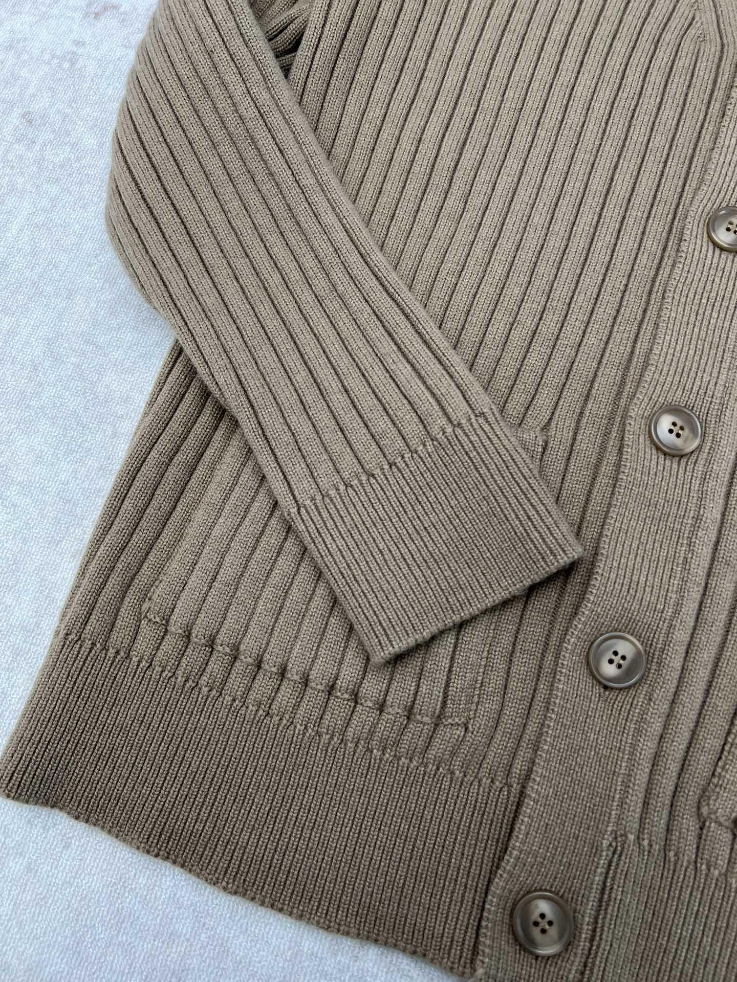Beige rib-knit cardigan with V-neck and button placket detail