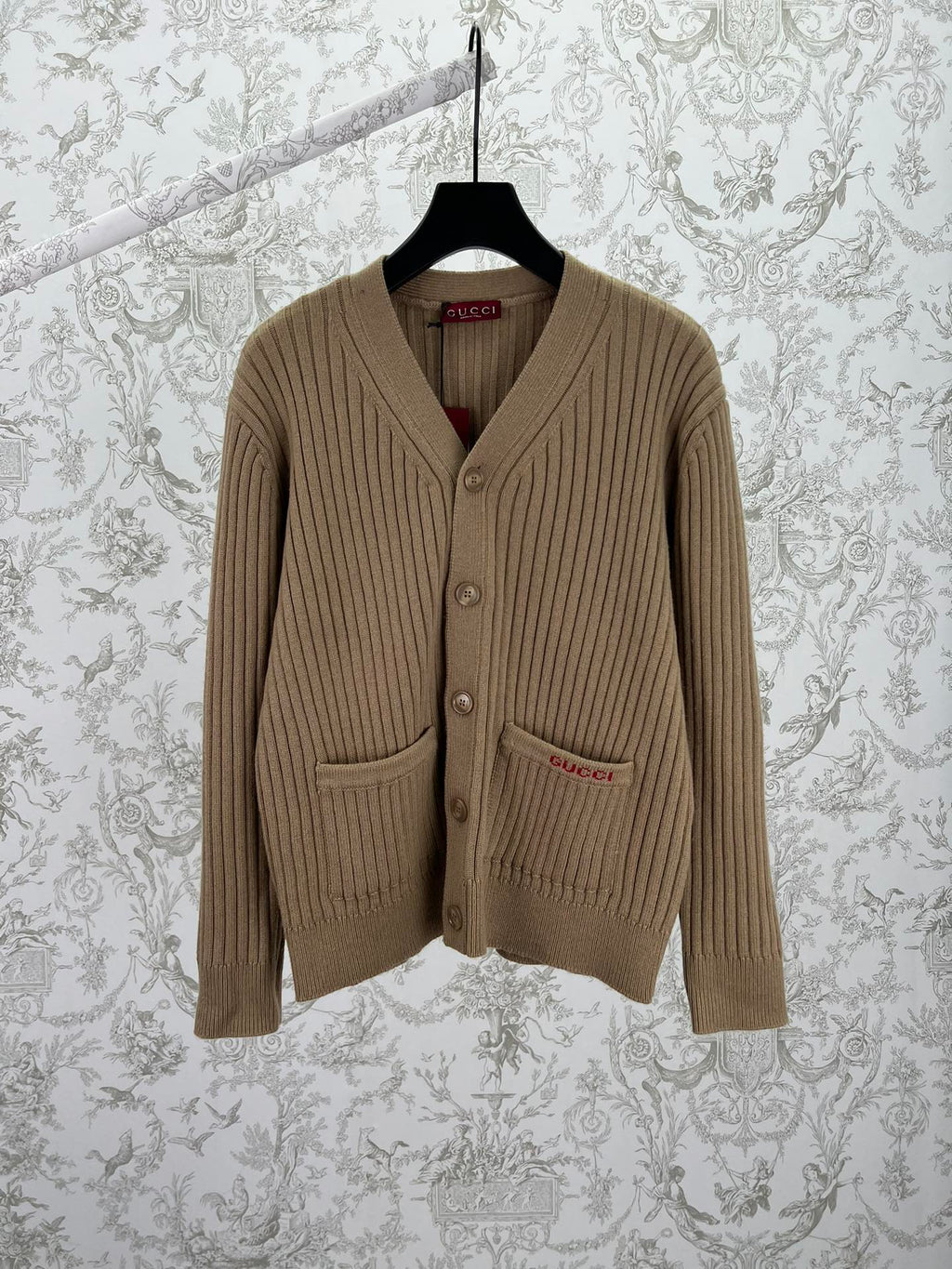 Beige rib-knit V-neck cardigan sweater with front button placket and pockets